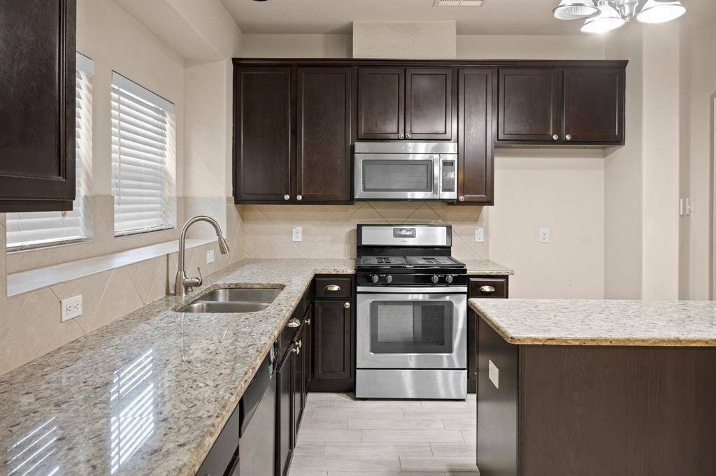 This charming kitchen offers a perfect balance of warmth, style, and functionality.
