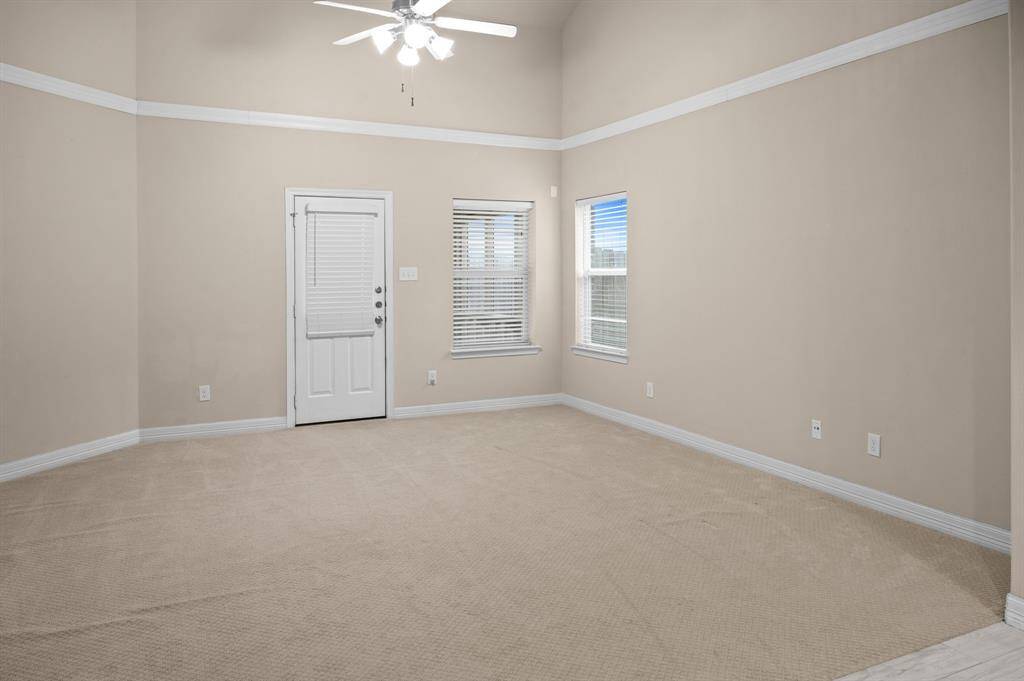 Living Room that leads directly to the covered patio. Perfect to use as a living room or dining room. Lots of possibilities!
