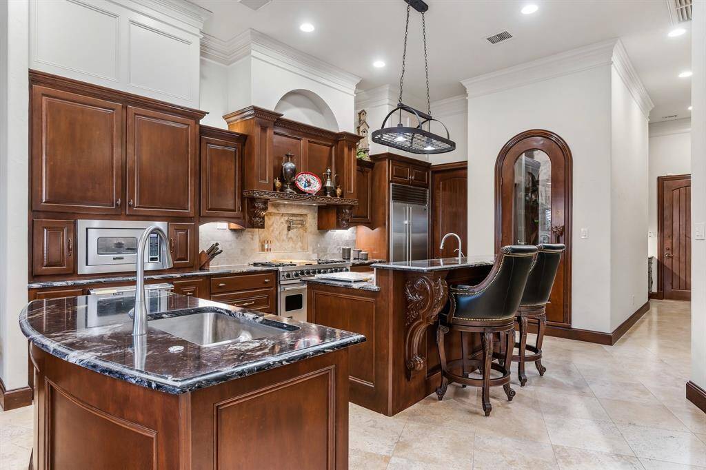 Gourmet kitchen with high-end appliances and ample counter space.