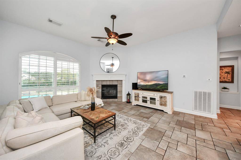 Spacious family room with great views of the pool and golf course.