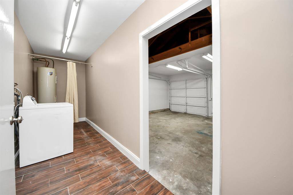 Laundry located adjacent to garage but inside the house. Oversized space for more storage here.