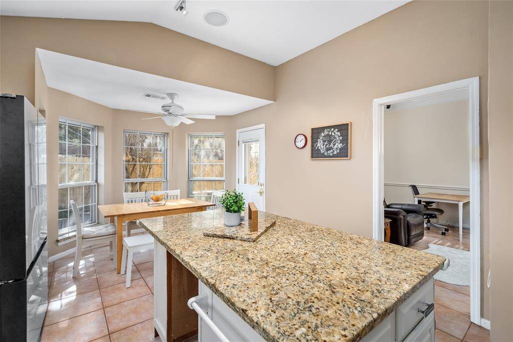 The wall of windows allows plenty of natural light to pour in, giving the space warmth and brightness during the day. As the sun sets, the soft glow of the light creates a calming, positive vibe, making the home feel inviting and cozy all through the evening.