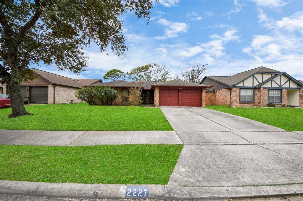 Beautiful tree in front yard. Double wide driveway for lots of off-street parking. Quiet dead-end street with no through traffic.