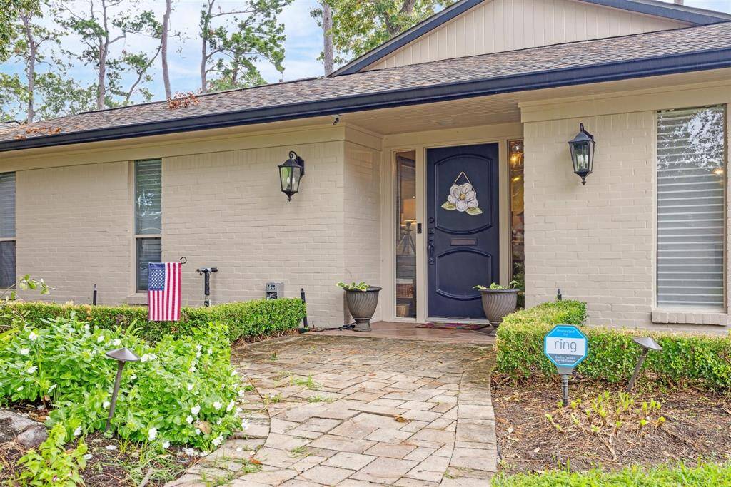 Formal living off of entry with views of backyard and beyond