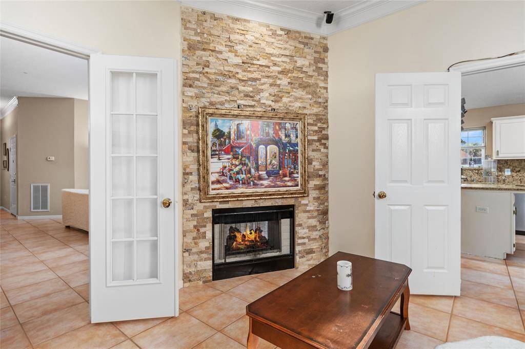 One of the fireplaces creates a cozy, inviting atmosphere in the living room, providing both warmth and charm. The stylish design enhances the room’s overall aesthetic, making it the perfect spot to relax and unwind, especially during cooler months.