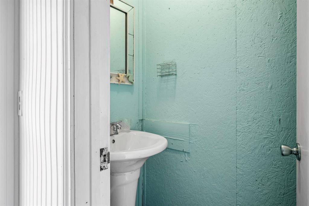 Lower level has additional bedroom with 1/2 bath for extra sleeping space