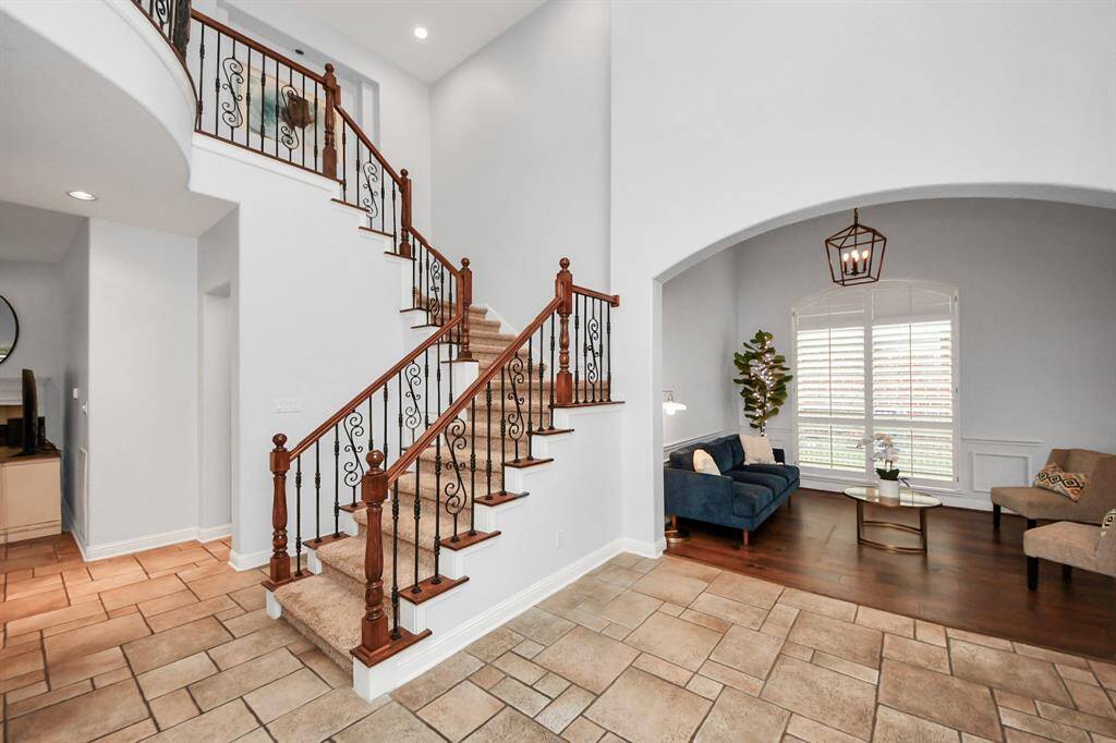 Iron staircase will lead you to 3 beds 2 bath and a game room.
