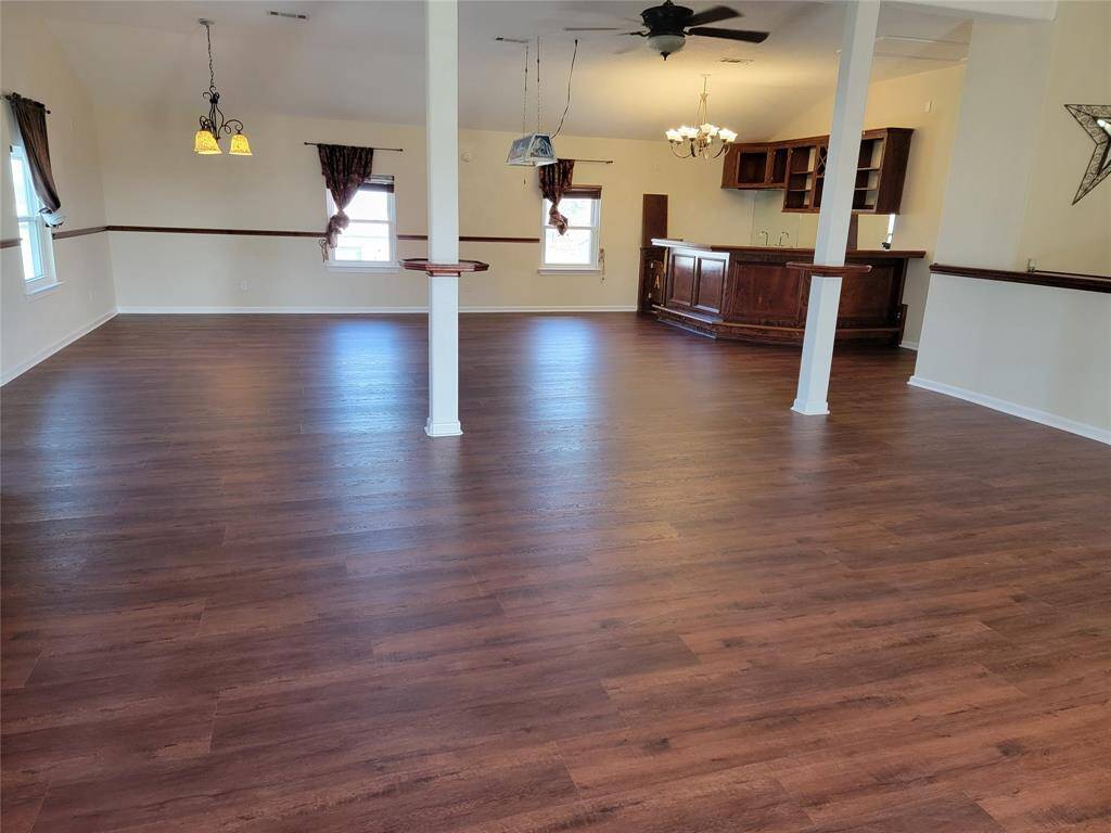 Spacious recreation area with customized bar. The area measures approximately 39'x29'.