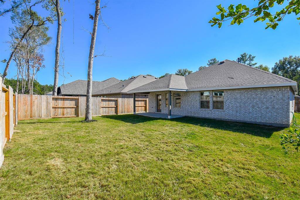 Easy to maintain backyard with full yard sprinkler system.