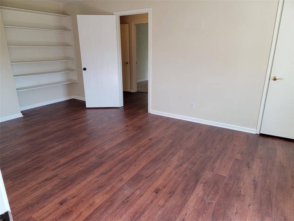 One of 6 bedrooms, this one with hard surface flooring.