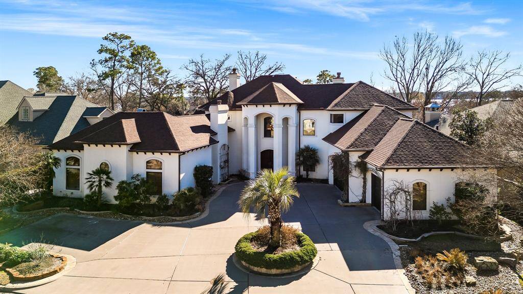 Stunning curb appeal with custom design by Jim Morris on a spacious 1/3-acre lot.