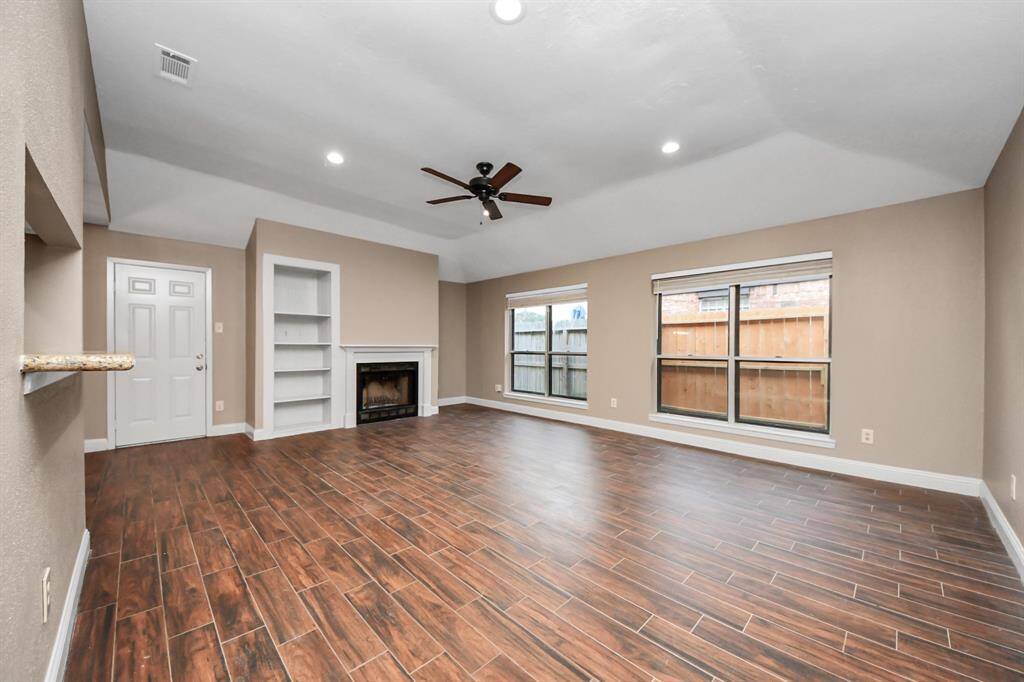 Freshly painted interior, wood-look tile floors throughout main living spaces.