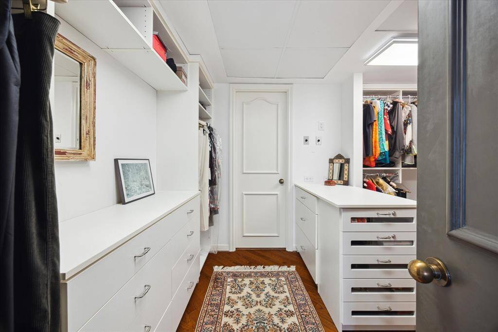 Partial view of custom primary closet.