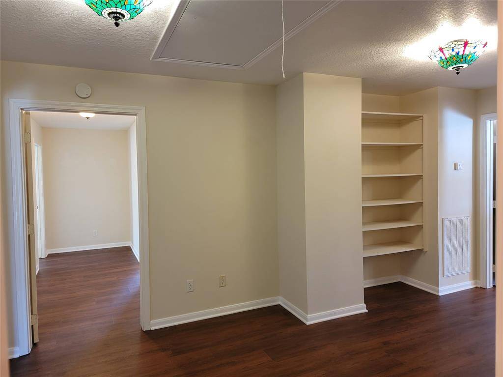 Upstairs corridor area connecting bedrooms, bath, recreation room, and storage.