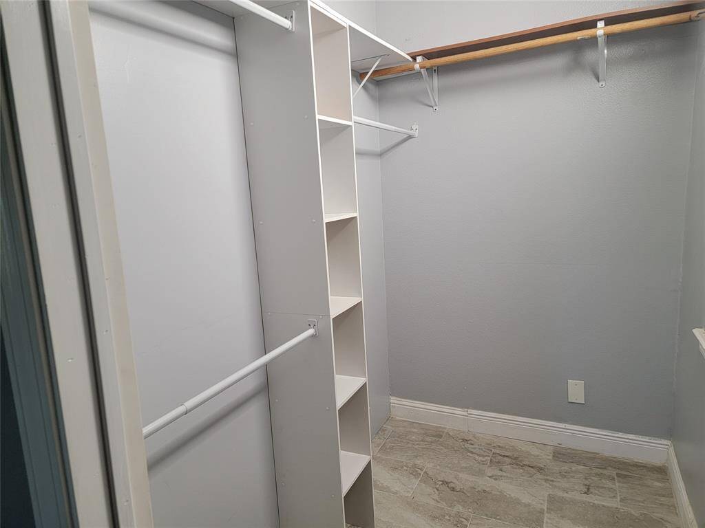 Walk in closet at primary bedroom.