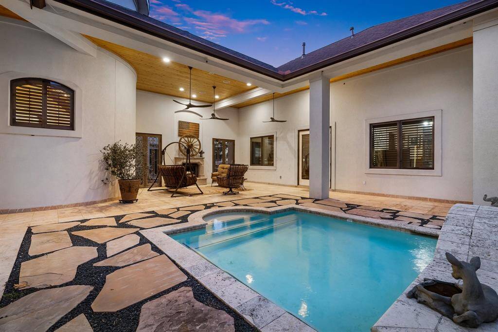 Gorgeous pool with a covered lanai, offering shade and comfort for year-round enjoyment.