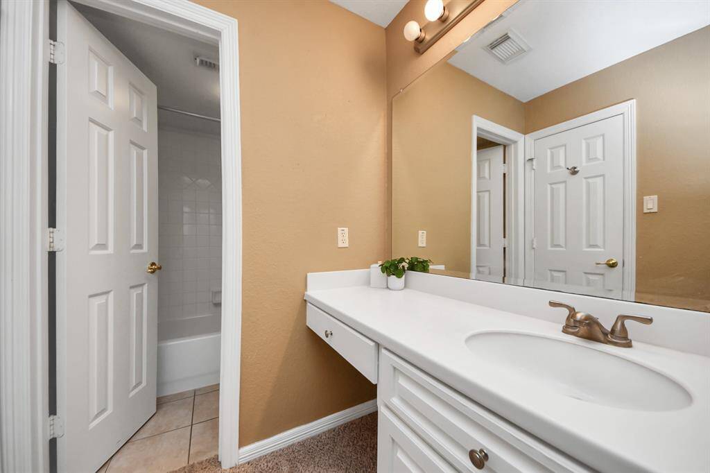 Second full bath located near the third bedroom upstairs.