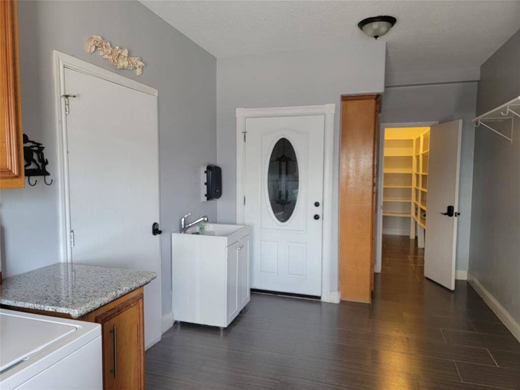 Oversized utility room and pantry at first floor.