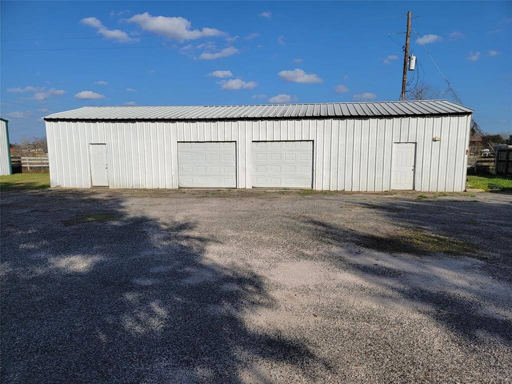 Storage building has 7' Height by 8' Width entries. The metal building is 60'x22'.