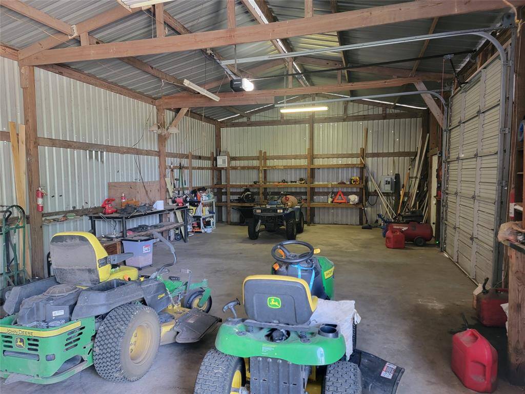 Shop interior with lawn machinery.