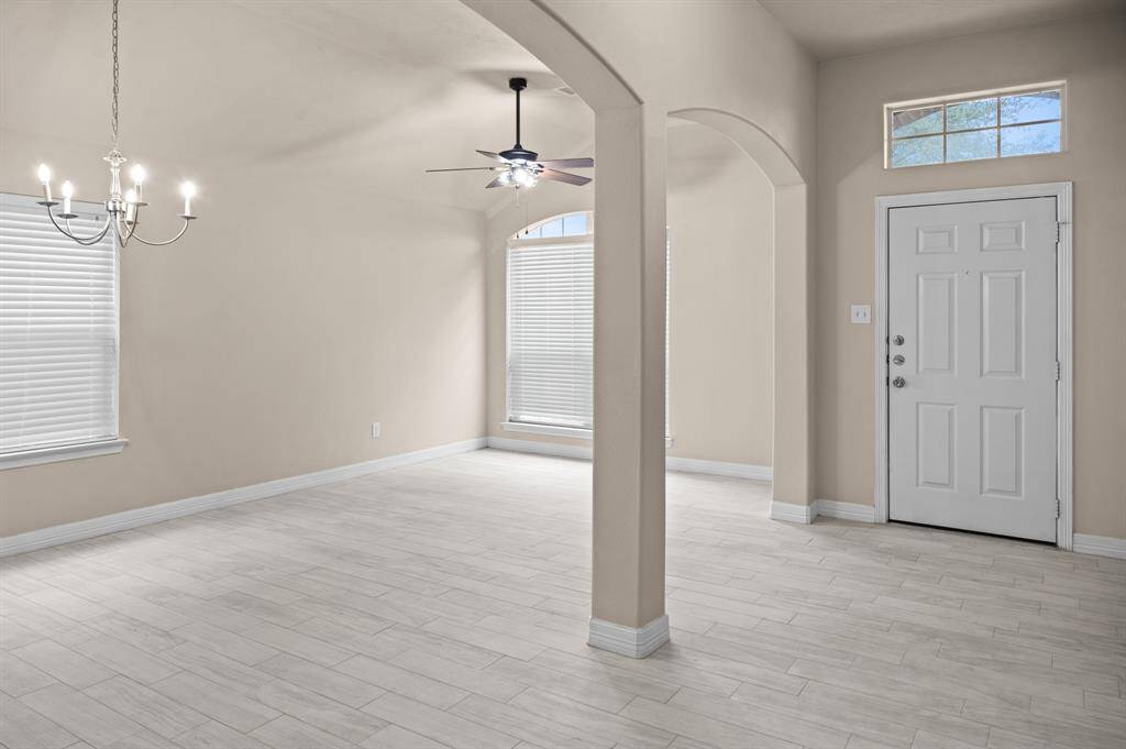 Step into this charming retreat to be used as a family room or formal dining.