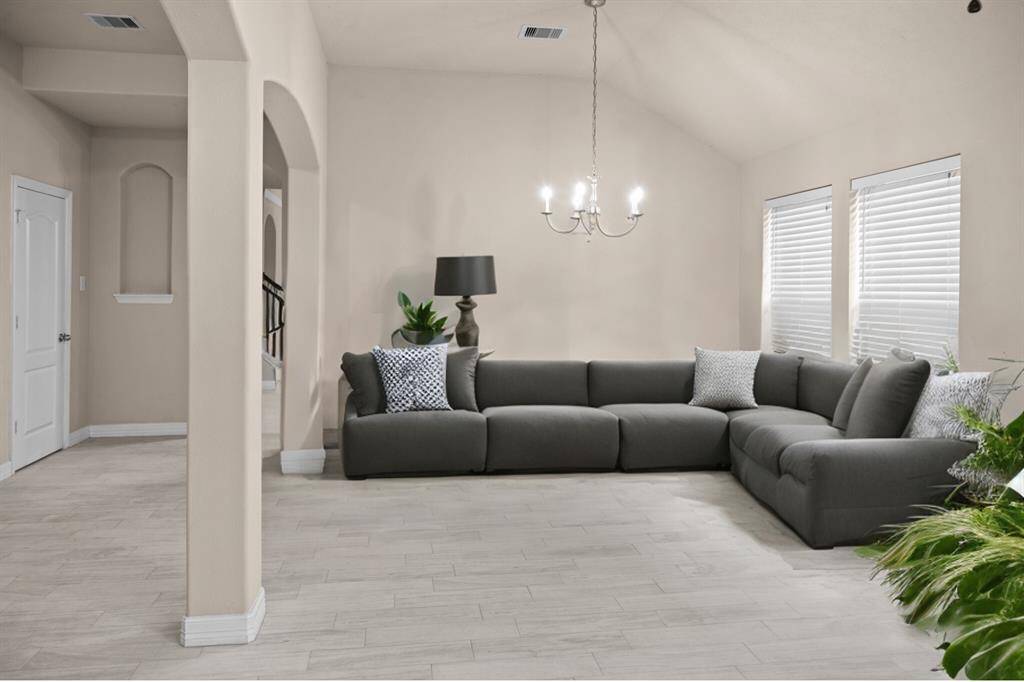 Imagine curling up with a good book or hosting loved ones in this warm, welcoming space.