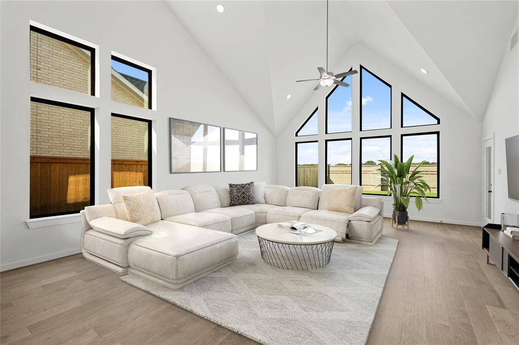 Virtual staging of this family room allows you to see a livable placement for furniture.