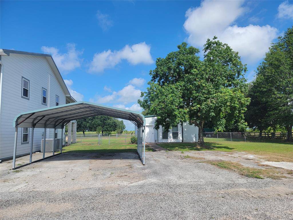 Covered parking between main home and apartment home.