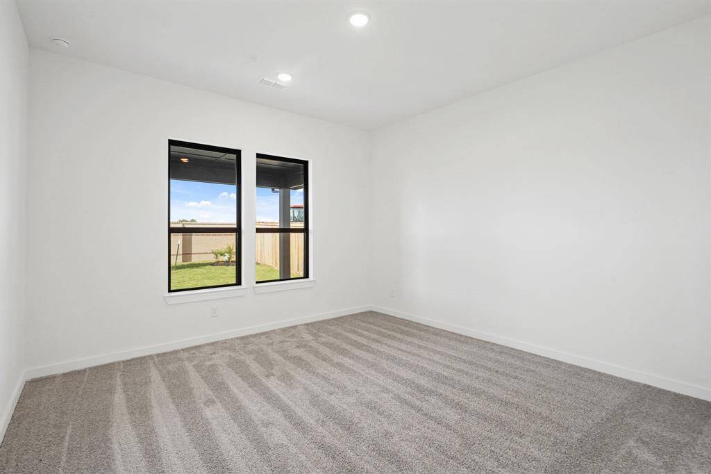 Main bedroom privately located off the back of the house with views of the covered patio.