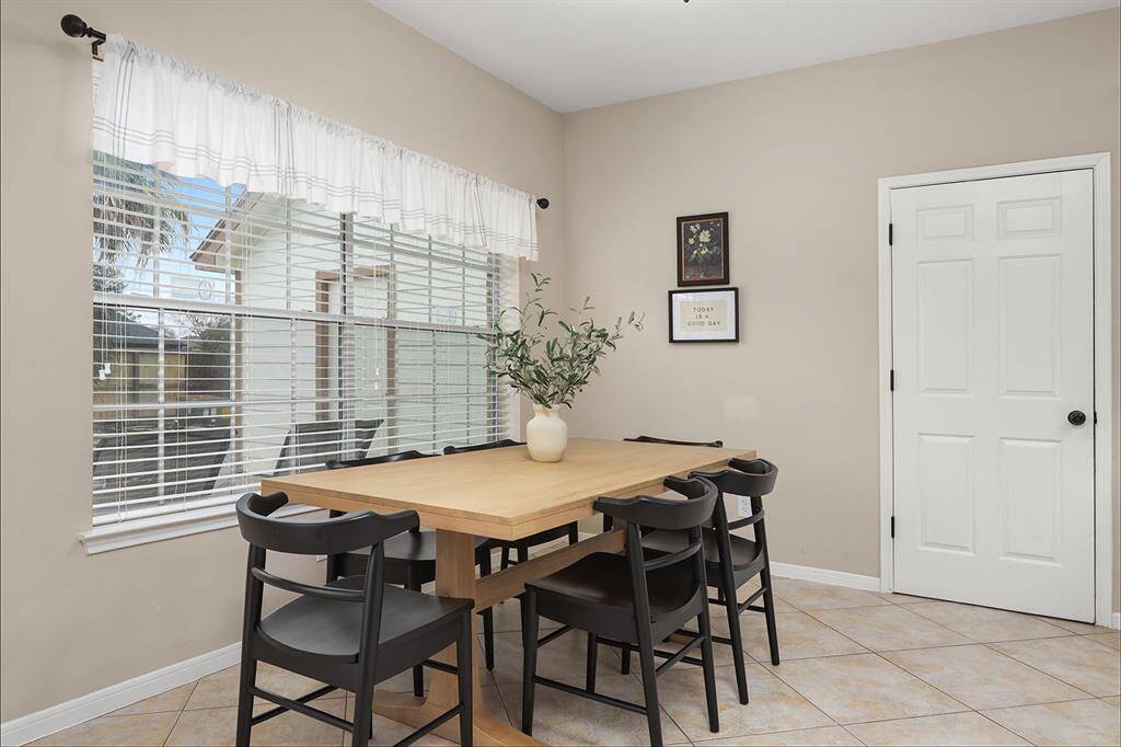 Breakfast Room Looks Out to Backyard Oasis