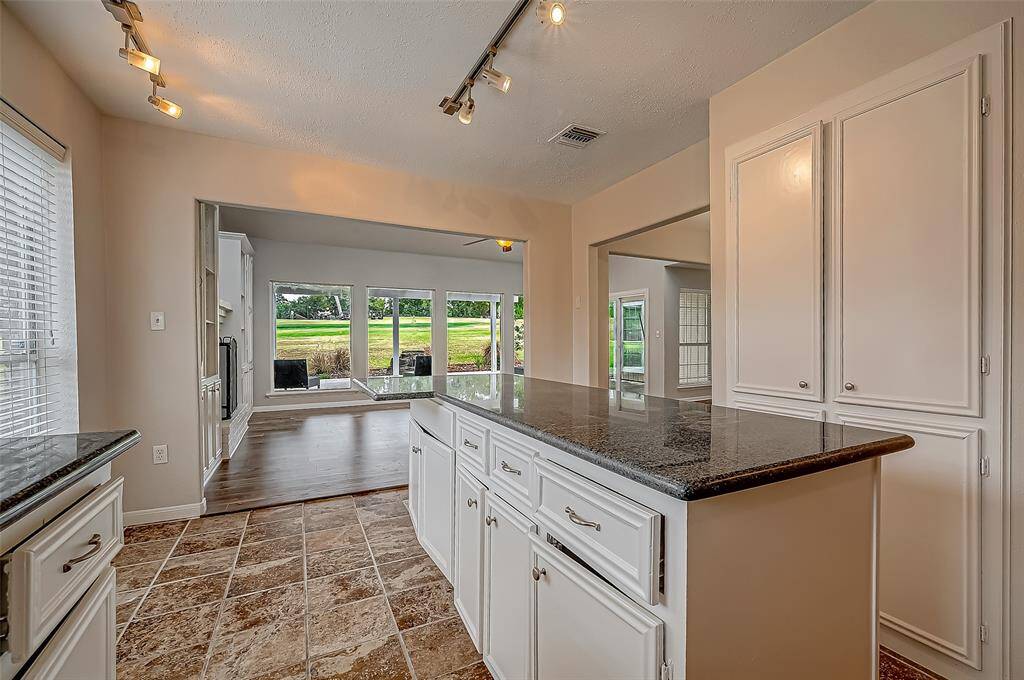 Ample cupboard space throughout the kitchen.