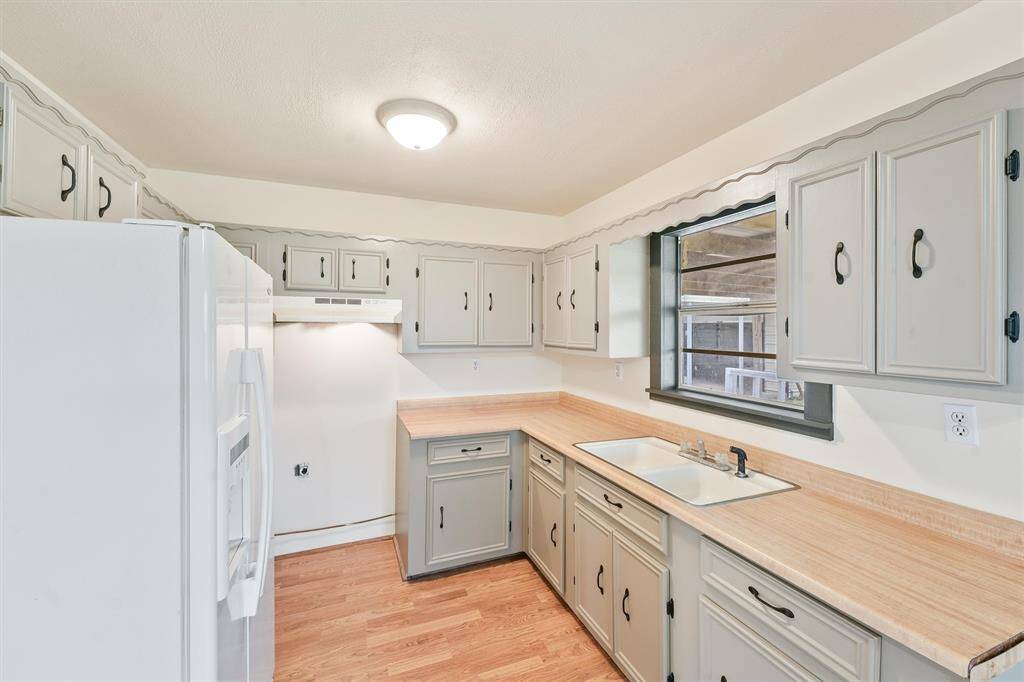 Charming kitchen freshly painted cabinets.