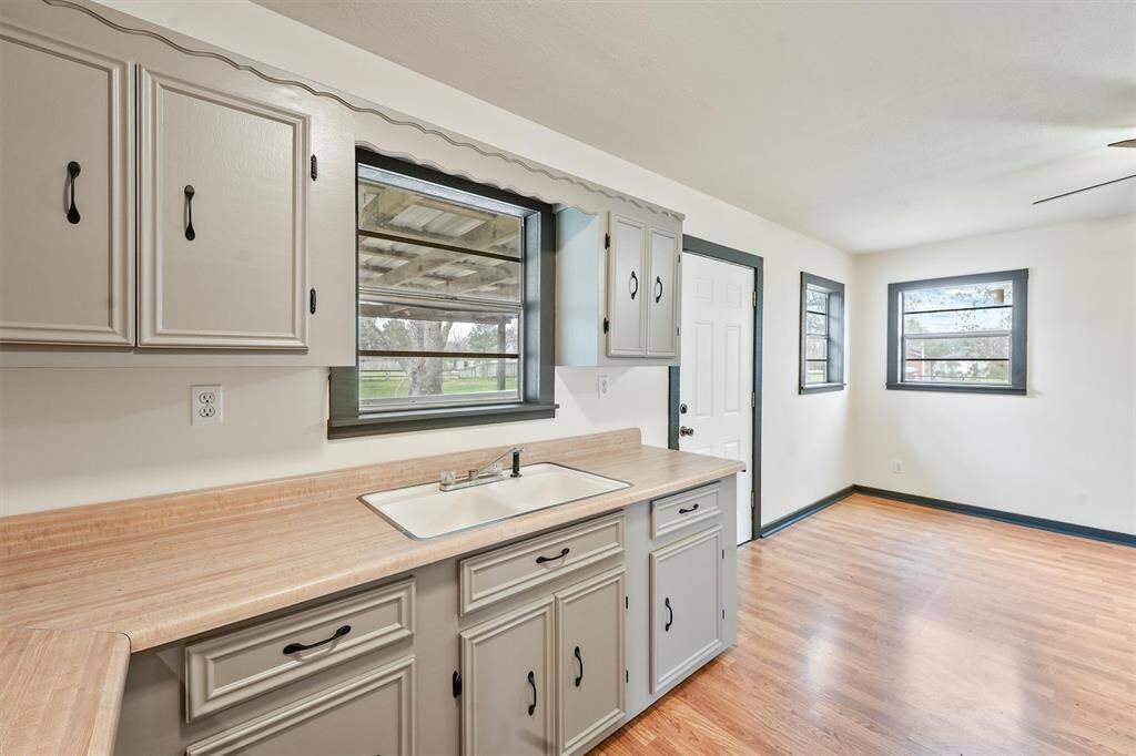 The kitchen is the heart of this home looking out on the back porch.