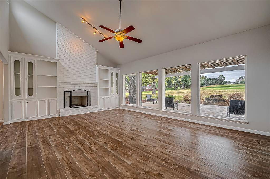 Living room with an abundance of natural light and a view of the golf course!