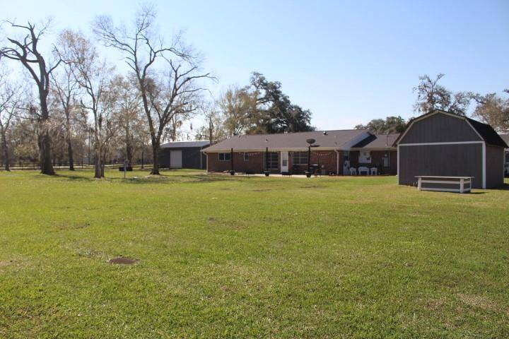 Back view of home and acreage