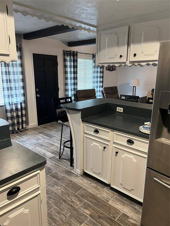 Another view of kitchen with breakfast bar
