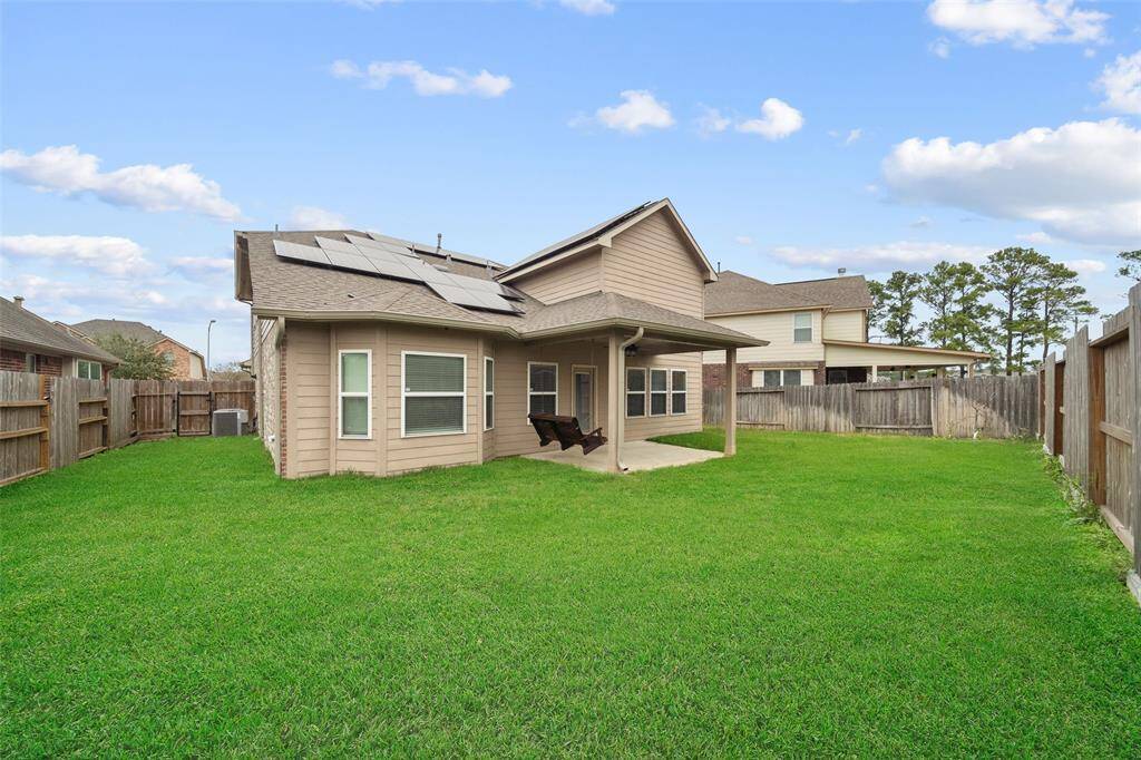 This home has covered back porch with swing and solar panels that greatly reduce electricity cost! There is plenty of room for playsets or garden.