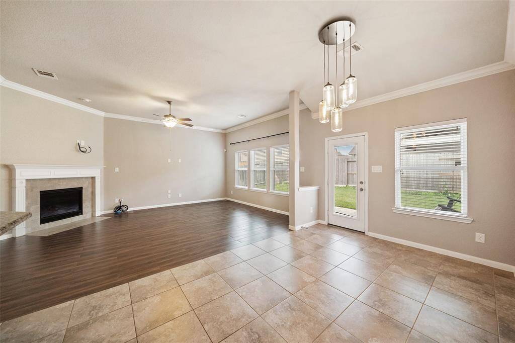Breakfast room back to den There is crown molding and tile floors thru out living area