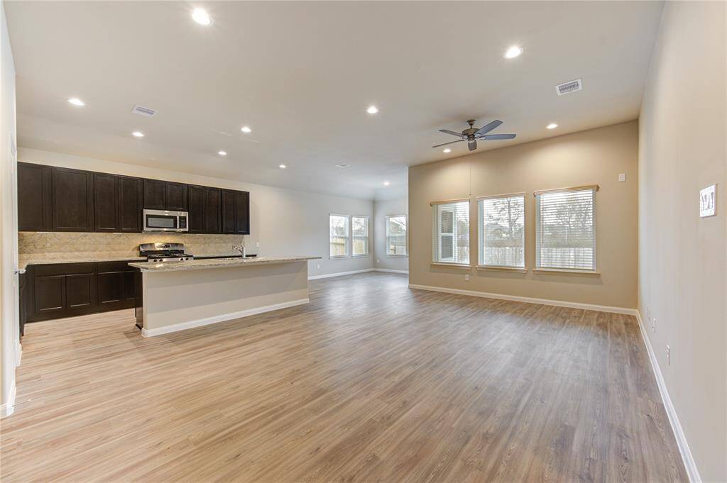 Around the combined spaces of family room, kitchen, and dining ...