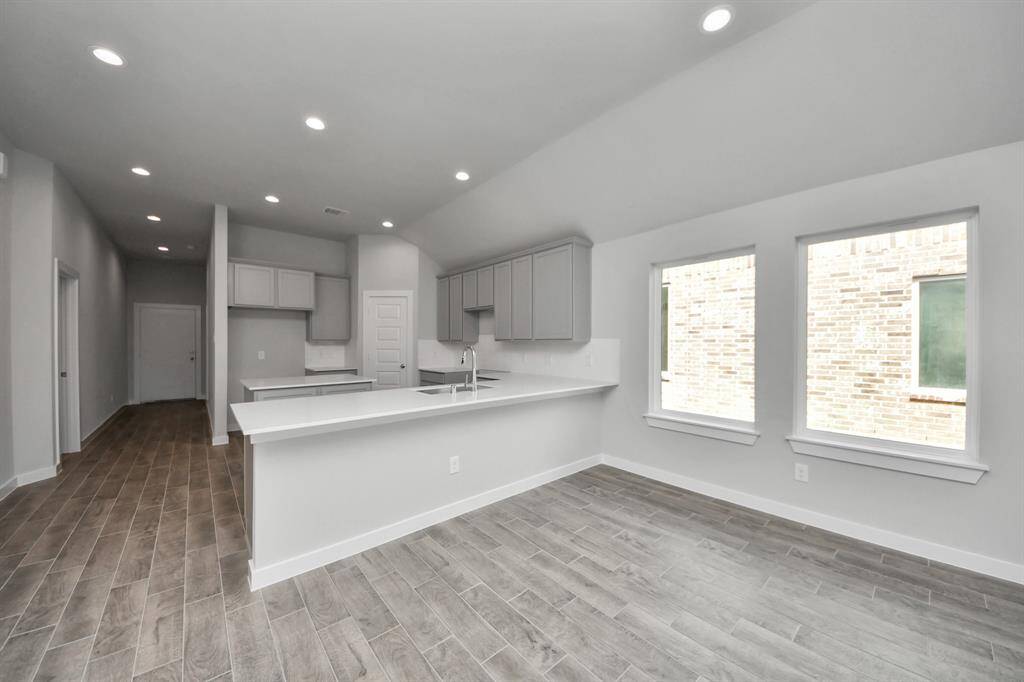 All of this overlooks your expansive family room, creating a perfect space for culinary delights and family gatherings.