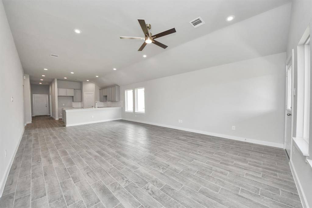Take another glimpse into the heart of the home with this additional view of the family room—a sprawling space ready to accommodate all your gatherings.