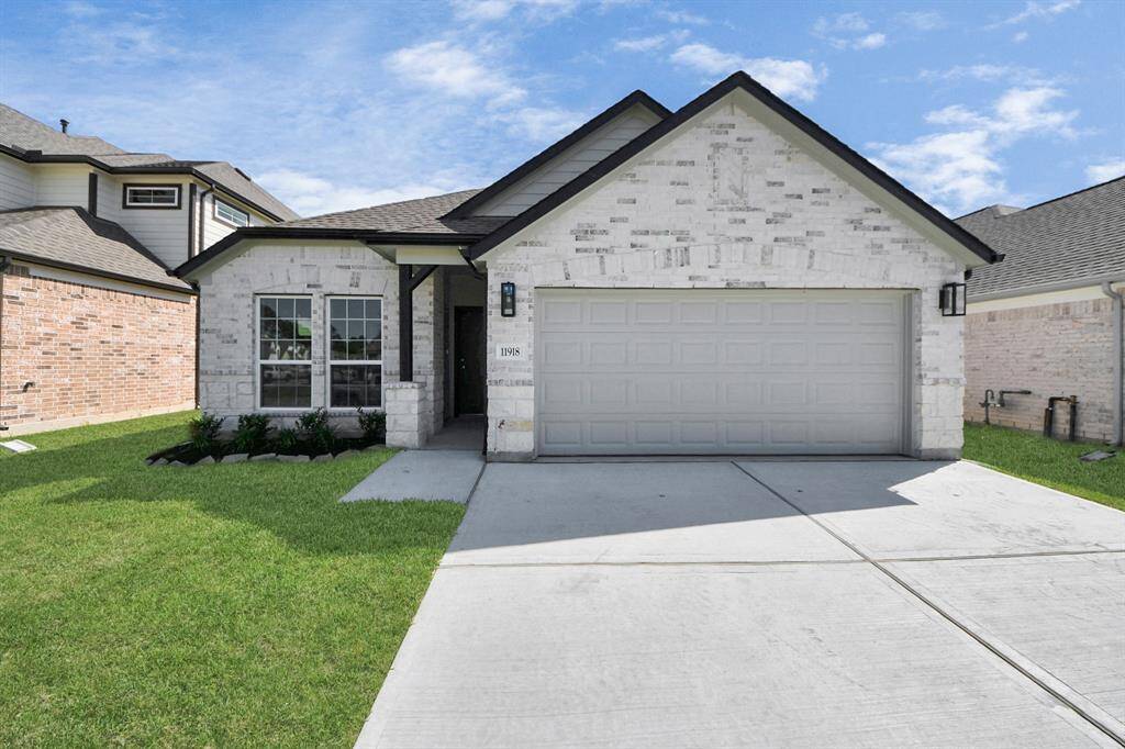 Home features a convenient 2-car garage complemented by a spacious driveway, offering ample parking for you and your guests.