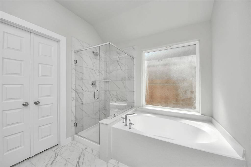 Indulge in a spa-like retreat within the confines of this primary bathroom.