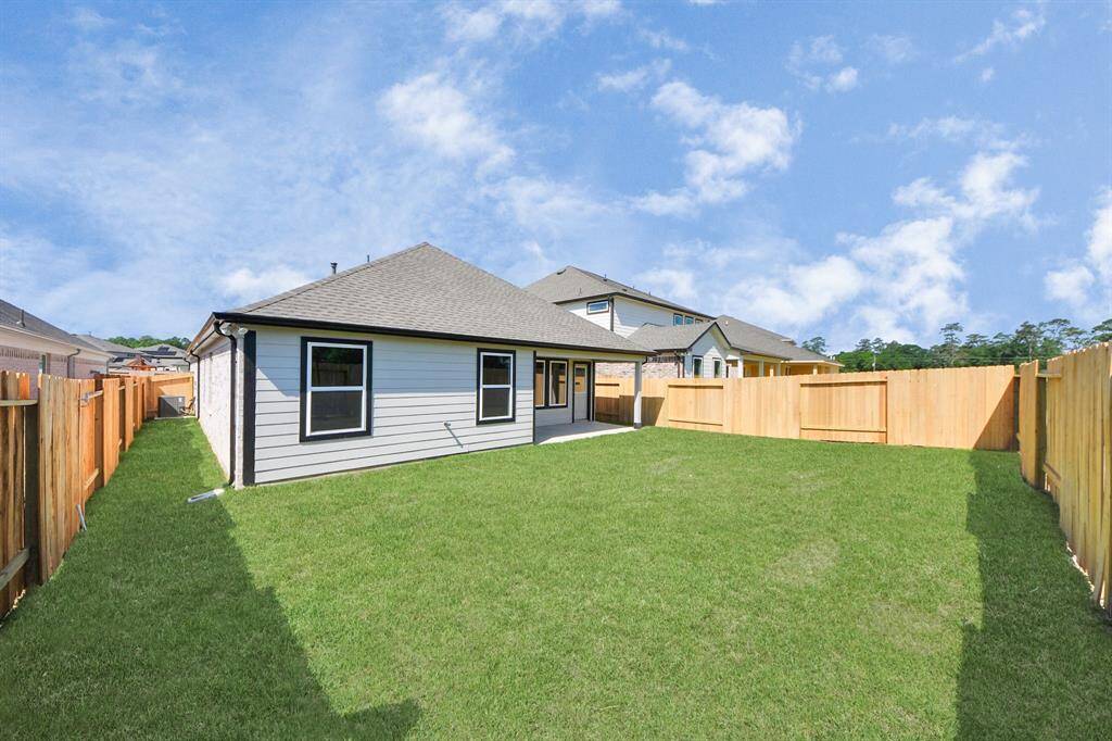 Come and see this spacious backyard with its beautiful covered patio. There is plenty of room for the kids to play and adults to relax. Perfect for your outdoor living space, patio furniture, bbq pit, and so much more. The possibilities are endless!