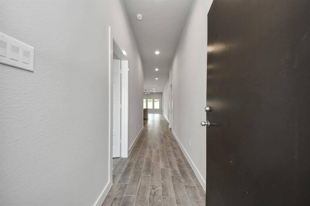 The grand entrance welcomes you with tile floors, oversized baseboards, and recessed lighting, setting the stage for a luxurious journey. Follow the Long Walkway to discover the open-concept kitchen and family room, where elegance meets comfort seamlessly.