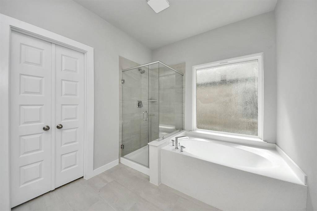 Upstairs can be used as game room or as additional living space.  Features plush carpet, high ceilings, custom paint and windows for plenty of natural light. Sample photo of completed home with similar floor plan. As-built interior colors and selections may vary.