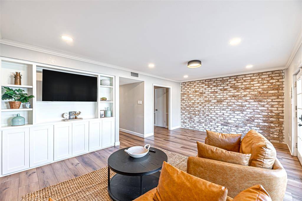 A different perspective of the den showcasing its spacious layout and decor potential.