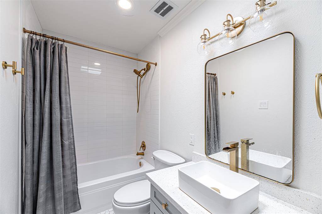 A well-maintained bathroom with modern fixtures and a sleek design for guest convenience.