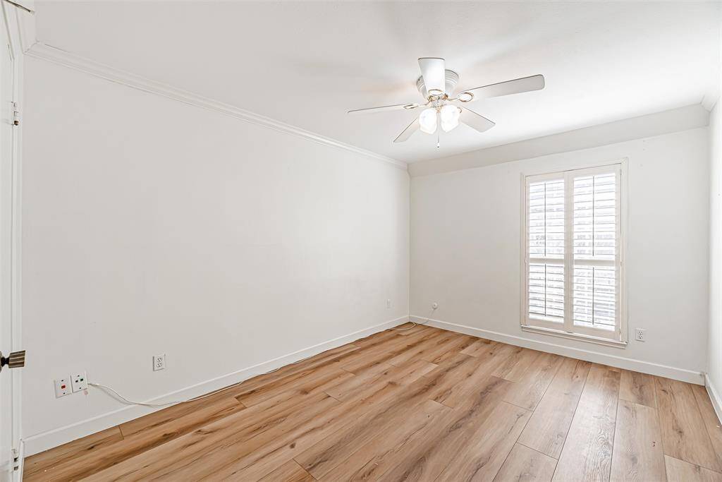 A bright and airy bedroom with ample closet space and large windows.
