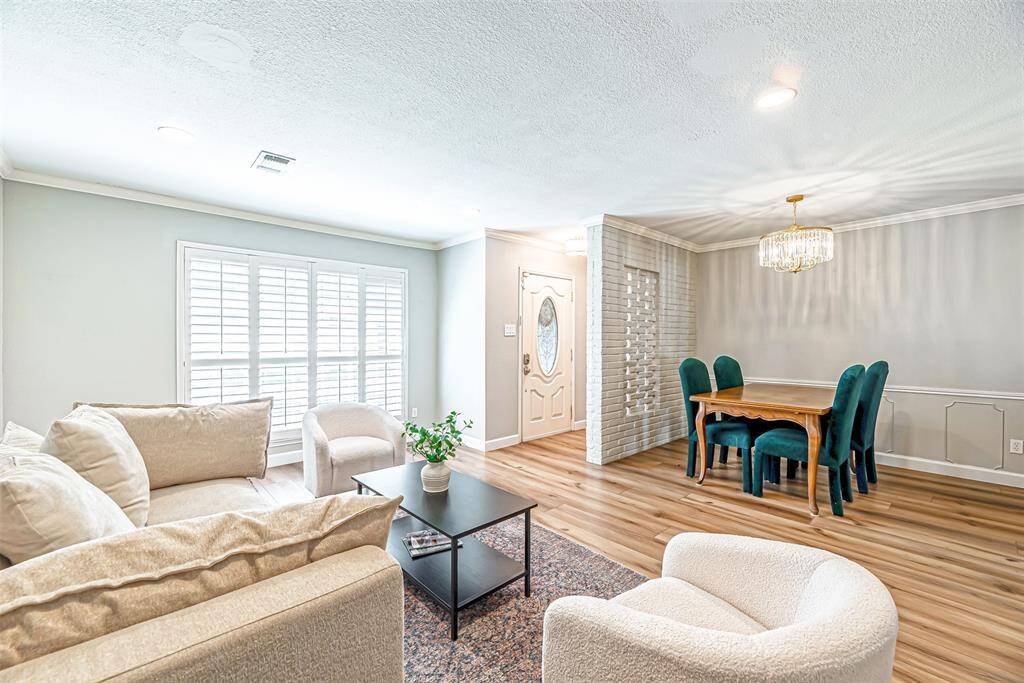 A spacious living area with plenty of natural light, perfect for relaxing or entertaining.